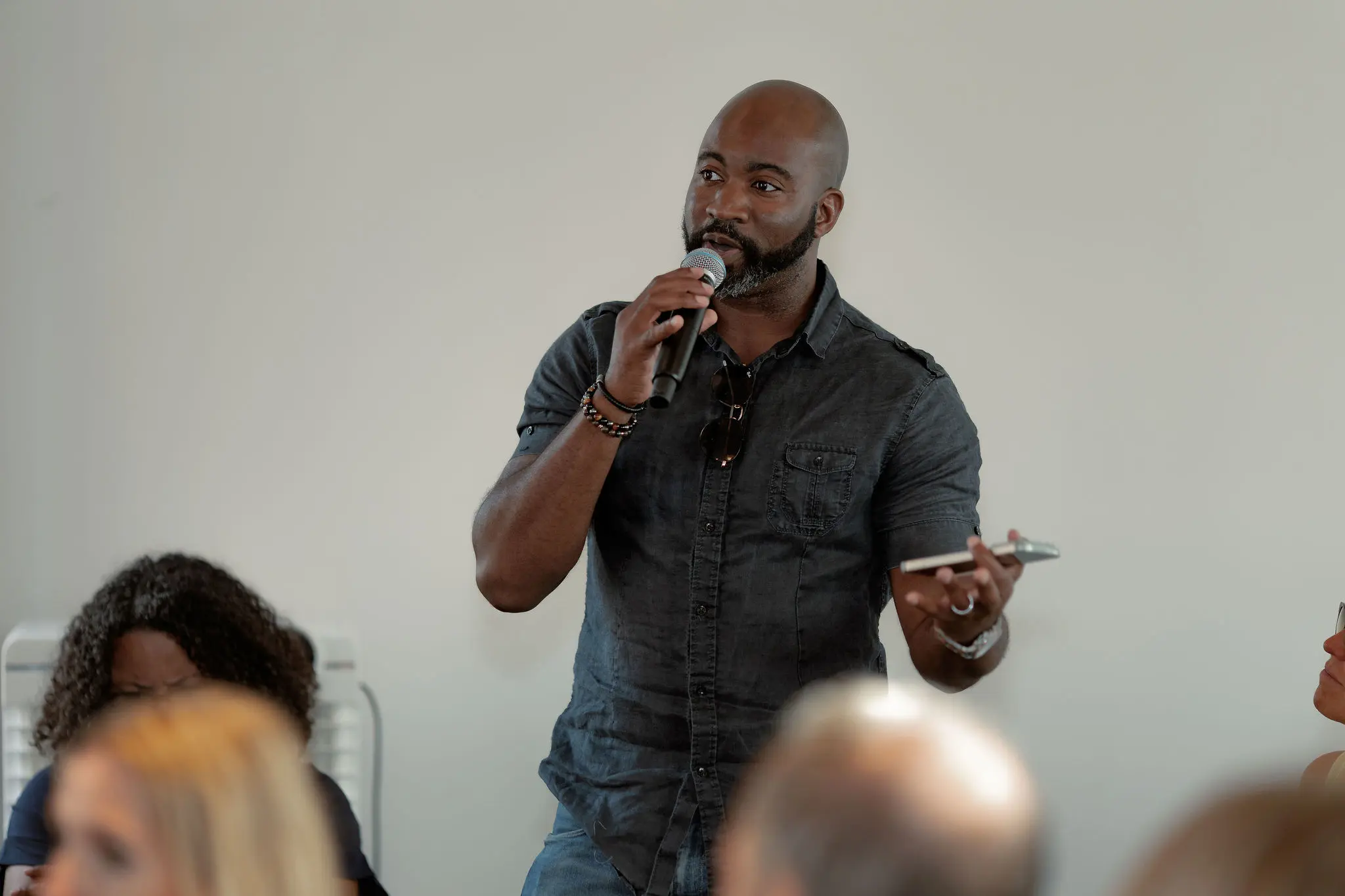 Speaker contributing to a discussion with a microphone at a Future Forum event in London