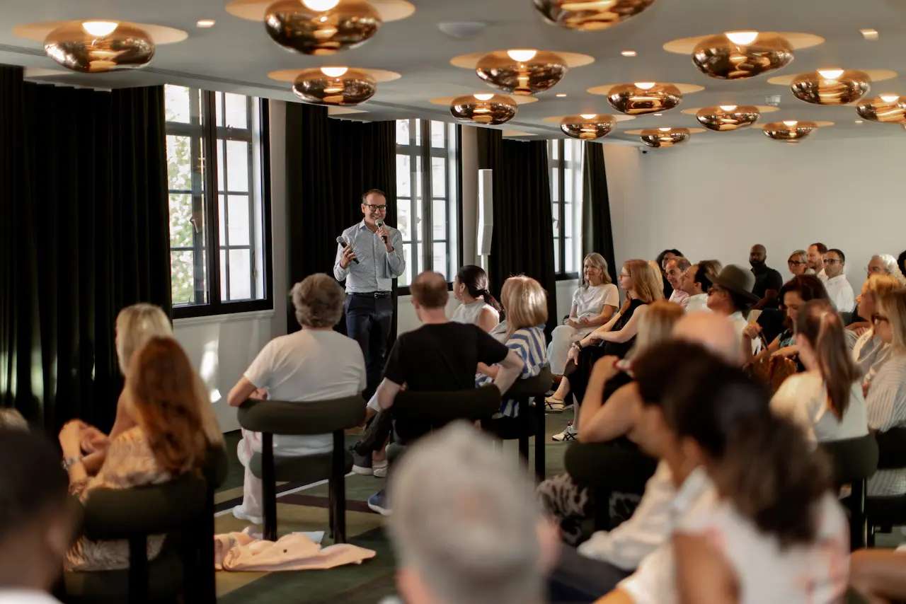 Speaker addressing an audience during a Future Forum event at Town Hall in London